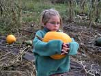 girl with big pumpkin